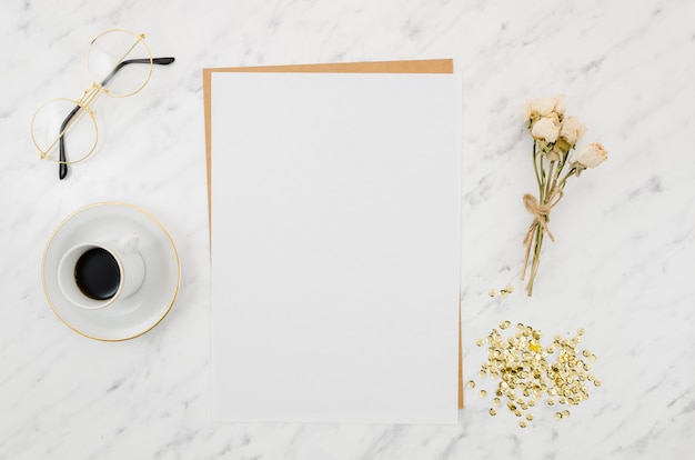 Flat lay paper mockup on workspace