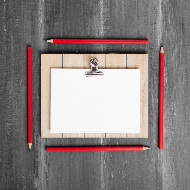 Free photo flat lay of papers and clipboard on wooden table