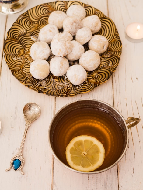 Free Photo flat lay pastries and lemon tea