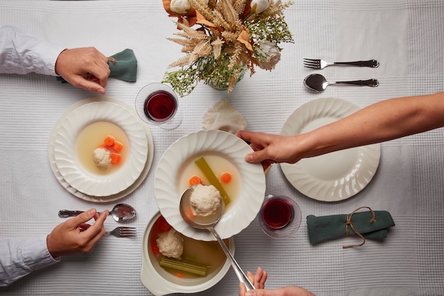 Free photo flat lay of people having a feast for the first day of passover seder