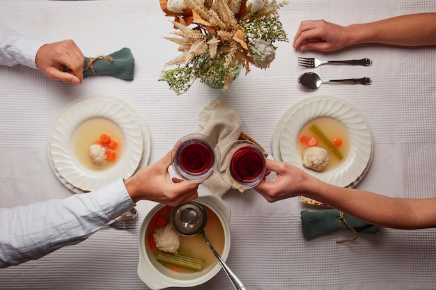 Free Photo flat lay of people having a feast for the first day of passover seder