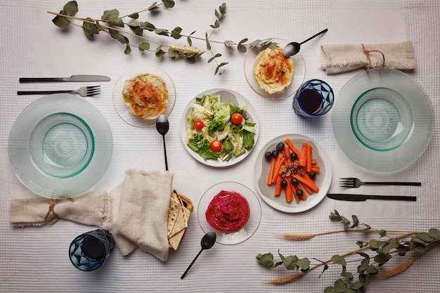 Free photo flat lay of people having a feast for the first day of passover seder