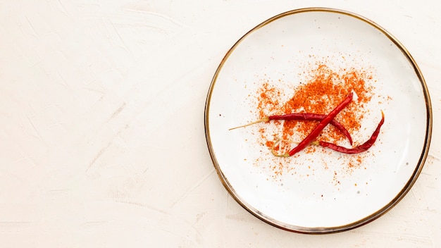 Flat lay peppers in a plate with copy-space