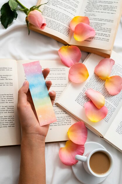 Flat lay petals on books arrangement