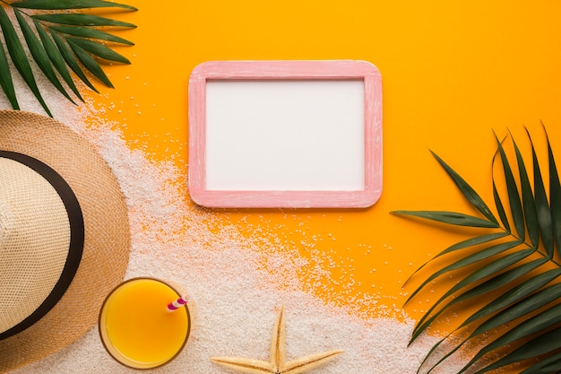 Free Photo flat lay picture frame with beach concept