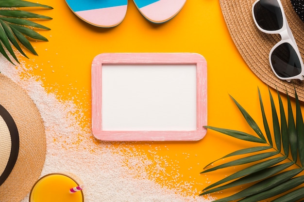 Free Photo flat lay picture frame with beach concept