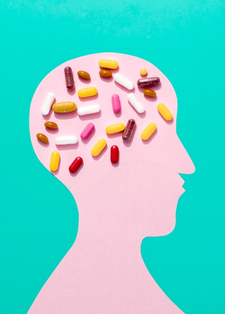 Flat lay of pills on brain of human shape