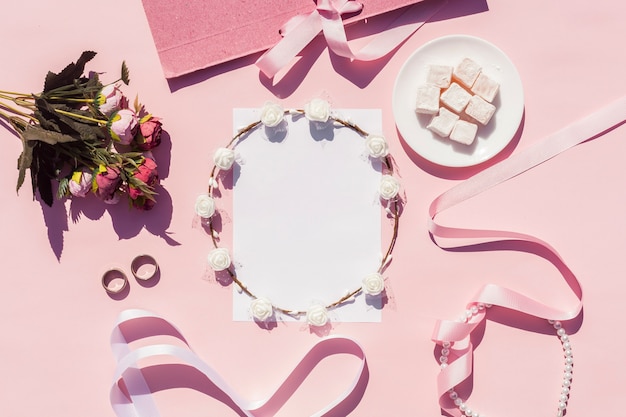 Free photo flat lay pink wedding arrangement with on background