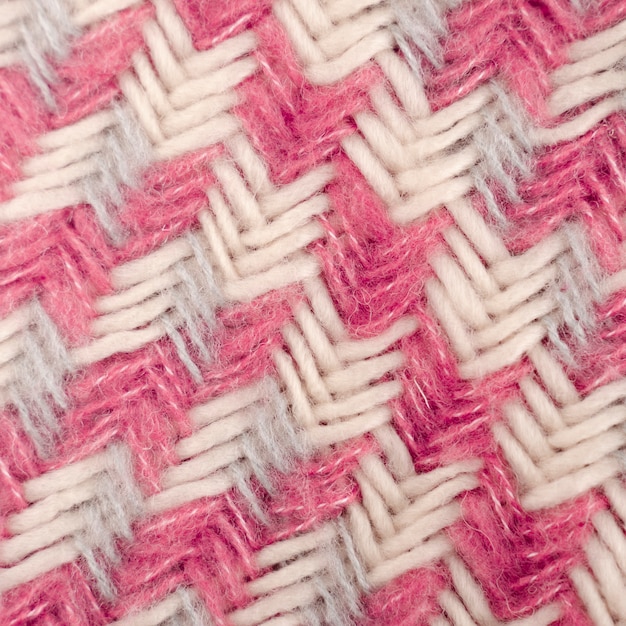 Free photo flat lay of pink and white wool pattern