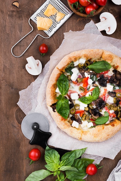 Flat lay pizza on wooden background