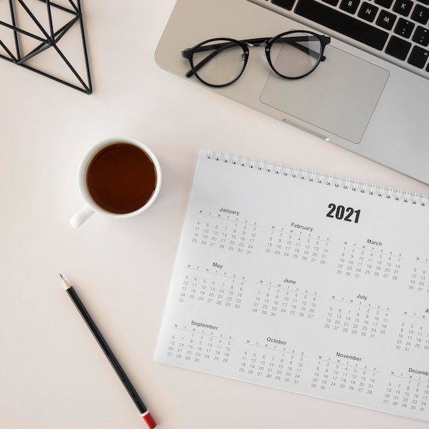 Flat lay planner calendar and cup of coffee