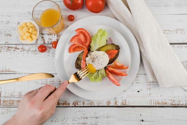 Free Photo flat lay plate with breakfast on table