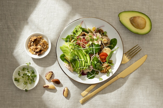 Flat lay of plate with keto diet food and nuts