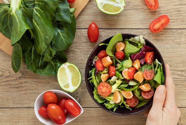 Flat lay plate with salad on table