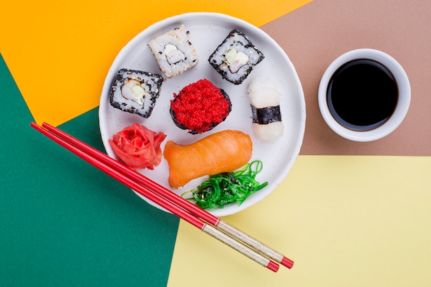 Flat lay plate with sushi and souce