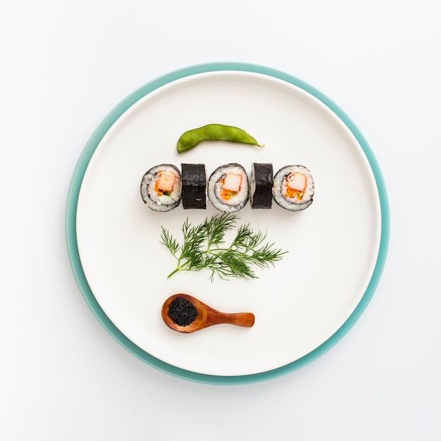 Free photo flat lay plate with sushi