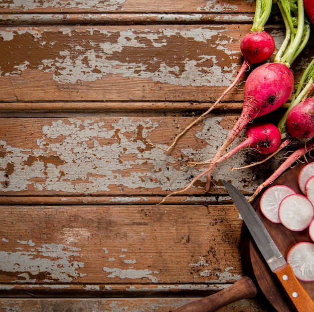 Free photo flat lay of radishes with copy space