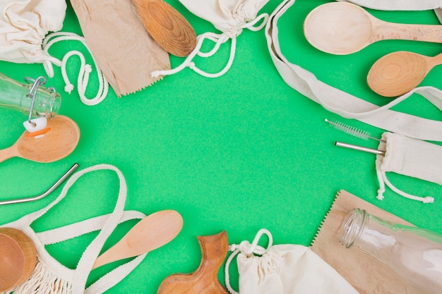 Free Photo flat lay of reusable bags with wooden spoons