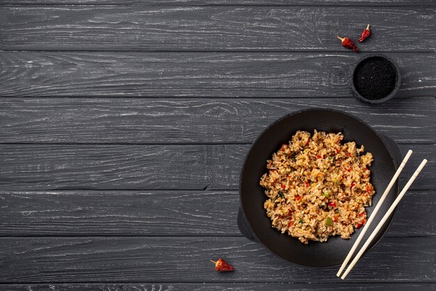 Flat lay rice and vegetables on plate with copy space