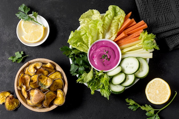 Free Photo flat lay of roasted potatoes in bowl with vegetables