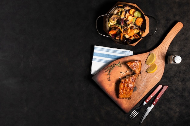 Free photo flat lay salmon with veggies