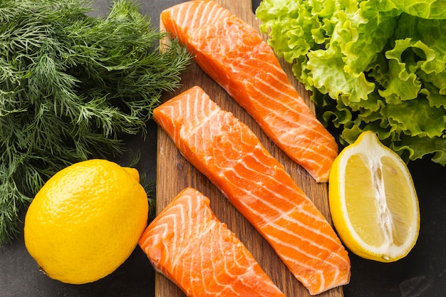 Flat lay salmon on wooden board