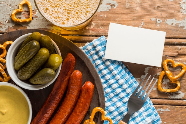 Flat lay of sausages with beer and sausages