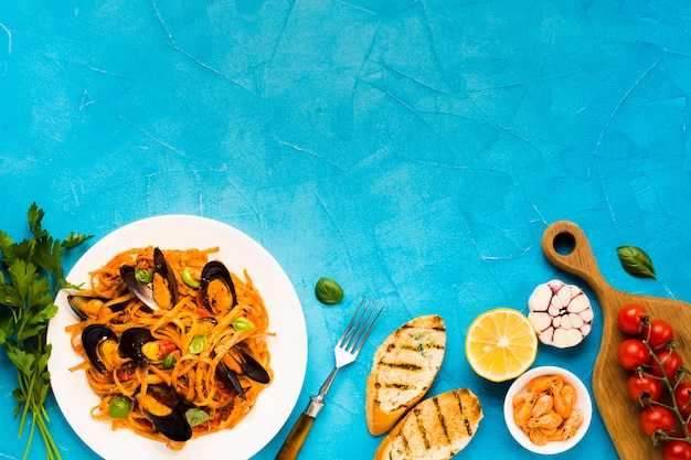 Flat-lay seafood dishes with copyspace