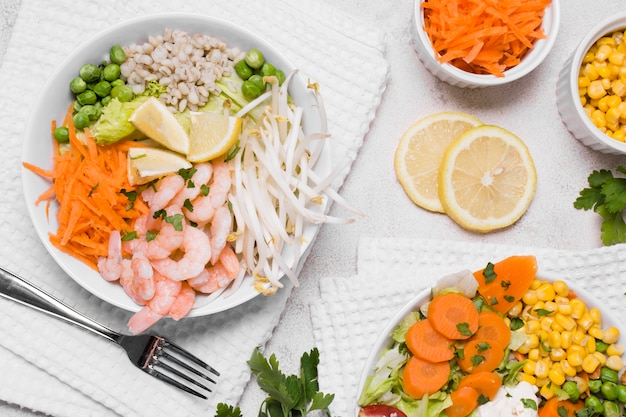 Free Photo flat lay of shrimp and vegetables on plates