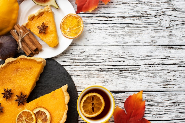 Free photo flat lay sliced pumpkin pie copy space