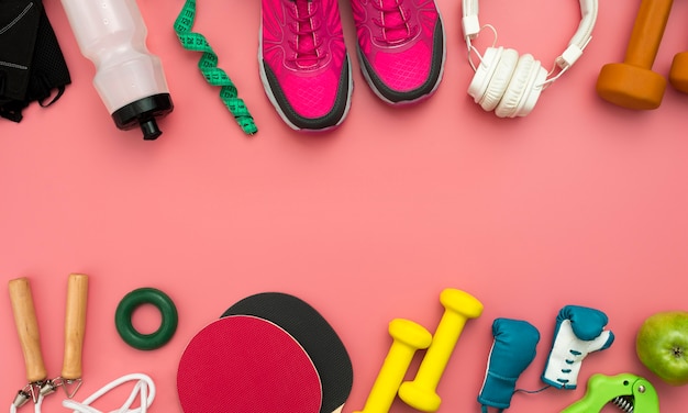 Flat lay of sneakers with gym essentials