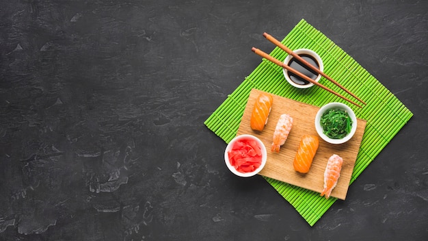 Flat lay sushi arrangement with copy space