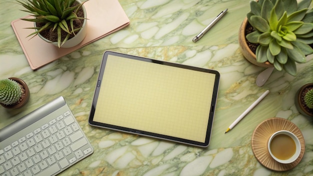 Free Photo flat lay of a tablet keyboard and potted plants on marble surface