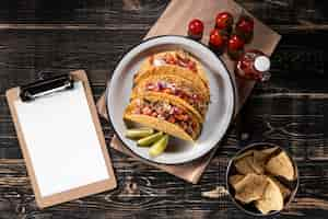 Free photo flat lay tacos with vegetables and meat