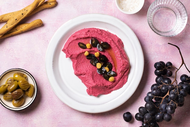 Free photo flat lay tasty hummus on plate still life