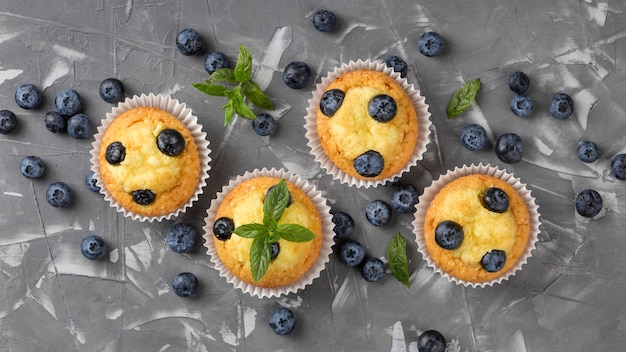 Free photo flat lay tasty muffin with blueberries