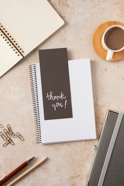 Flat lay thank you note and notebook