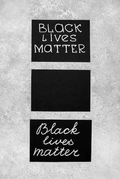 Free photo flat lay of three cards with black lives matter