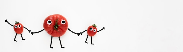 Free Photo flat lay tomatoes holding hands