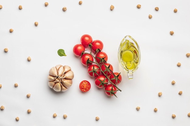 Free photo flat lay of tomatoes with garlic and oil