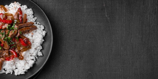 Flat lay of traditional asian rice dish with meat