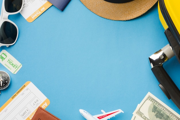 Free photo flat lay of travel essentials with sunglasses and money