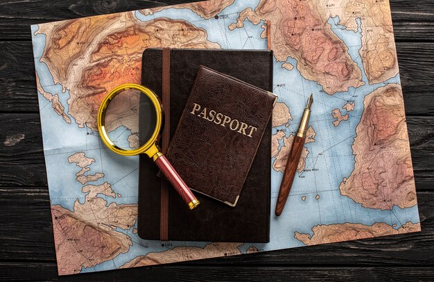 Flat lay travel set with map and magnifying glass