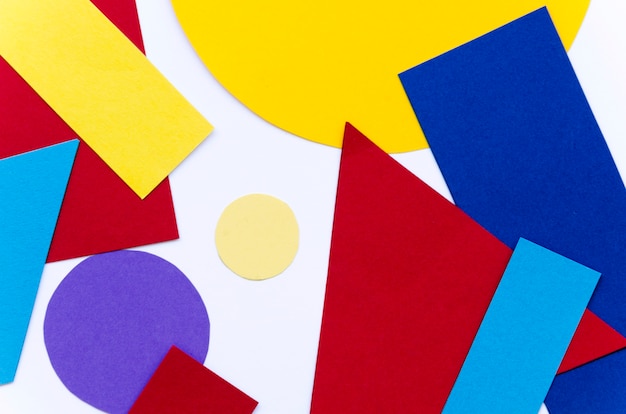 Free Photo flat lay of variety of multicolored paper shapes