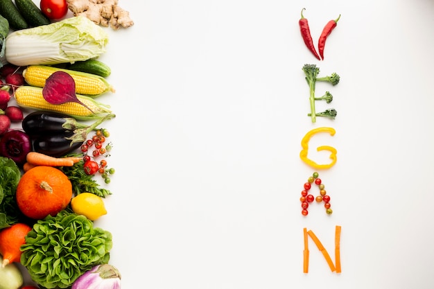 Free Photo flat lay vegan lettering made out of vegetables 