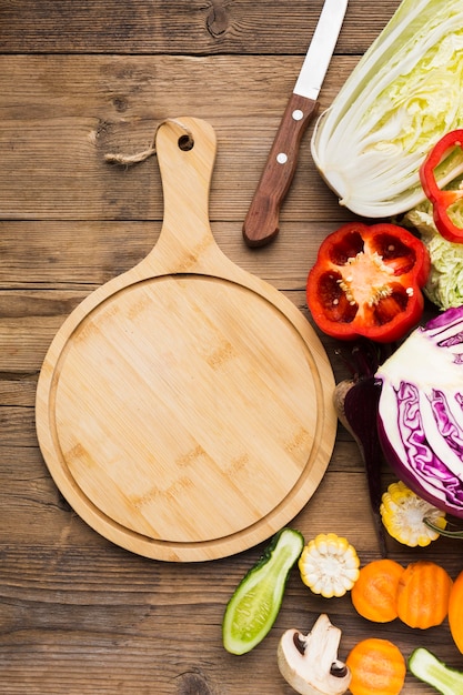 Flat lay vegetables composition on wooden background