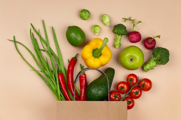 Flat lay vegetables and paper bag