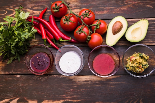 Flat lay of vegetables and sauces