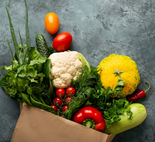 Flat lay vegetables on stucco background