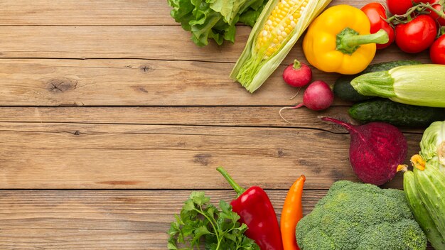 Flat lay vegetables on wooden table